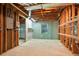 Unfinished basement space awaiting customization with exposed ceiling and garage access at 5059 Winding Hills Lane Ln, Woodstock, GA 30189