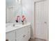 Bright bathroom with a white vanity and mirror at 5059 Winding Hills Lane Ln, Woodstock, GA 30189