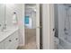 Bathroom showing a white vanity, shower and view into the neutral colored bedroom at 5059 Winding Hills Lane Ln, Woodstock, GA 30189