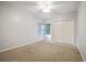 Bright bedroom featuring carpet flooring, ceiling fan, double door closet and good natural light at 5059 Winding Hills Lane Ln, Woodstock, GA 30189