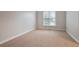 Bright bedroom with carpet flooring and a window, providing a comfortable and peaceful retreat at 5059 Winding Hills Lane Ln, Woodstock, GA 30189