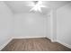 Bright bedroom with a ceiling fan, wood-look floors and closet at 5059 Winding Hills Lane Ln, Woodstock, GA 30189