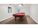 Spacious game room with a red felt billiards table and wood-look flooring at 5059 Winding Hills Lane Ln, Woodstock, GA 30189