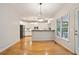 Eat-in kitchen area with hardwood floors, stainless appliances, and views to the kitchen at 5059 Winding Hills Lane Ln, Woodstock, GA 30189