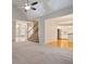 Bright living room with high ceilings, a staircase and an open floor plan flowing into the kitchen at 5059 Winding Hills Lane Ln, Woodstock, GA 30189