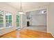Breakfast nook with hardwood floors and views to the living room and back deck at 5059 Winding Hills Lane Ln, Woodstock, GA 30189