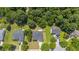 An aerial view reveals a home in a serene setting surrounded by lush greenery and offering a sense of privacy at 706 Hillmont Dr, Loganville, GA 30052