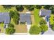 An aerial view showcases a home with well-maintained landscaping and a private backyard in a peaceful neighborhood setting at 706 Hillmont Dr, Loganville, GA 30052
