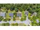 An aerial view captures a home in a tranquil neighborhood with mature trees and well-maintained landscaping at 706 Hillmont Dr, Loganville, GA 30052