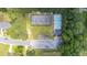 Overhead shot of neighborhood amenities like a community pool, tennis court, playground, and parking area at 706 Hillmont Dr, Loganville, GA 30052