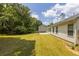 The expansive backyard presents a patio, lush lawn, and a serene outdoor space for relaxation and enjoyment at 706 Hillmont Dr, Loganville, GA 30052