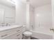 Bathroom featuring modern vanity with marble countertop and shower-tub combination at 706 Hillmont Dr, Loganville, GA 30052