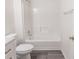 Clean bathroom featuring a shower-tub combination at 706 Hillmont Dr, Loganville, GA 30052