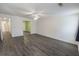 Well-lit bedroom boasts gray flooring, ceiling fan, and three access points at 706 Hillmont Dr, Loganville, GA 30052