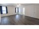 Large, airy bedroom featuring gray floors, ceiling fan, and natural lighting at 706 Hillmont Dr, Loganville, GA 30052