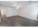 Comfortable bedroom features gray flooring, a ceiling fan, and ample storage options at 706 Hillmont Dr, Loganville, GA 30052