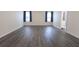 Spacious bedroom with natural light, gray flooring, and neutral wall paint at 706 Hillmont Dr, Loganville, GA 30052