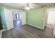 Bright bedroom with modern ceiling fan, laminate flooring, and en-suite bathroom at 706 Hillmont Dr, Loganville, GA 30052