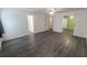 Open bedroom with multiple doorways, gray floors, and ample natural light at 706 Hillmont Dr, Loganville, GA 30052