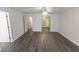 Sunlit bedroom with several doorways, gray floors, and neutral wall paint at 706 Hillmont Dr, Loganville, GA 30052