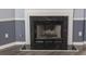 Close-up of the fireplace with decorative marble surround at 706 Hillmont Dr, Loganville, GA 30052