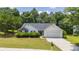 Charming single-story home featuring well-manicured lawn, complemented by mature trees and a two car garage at 706 Hillmont Dr, Loganville, GA 30052