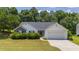 Charming one story home on a landscaped lot with a two-car garage and a welcoming front lawn at 706 Hillmont Dr, Loganville, GA 30052