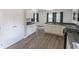 Open concept kitchen with white cabinets and stainless steel appliances at 706 Hillmont Dr, Loganville, GA 30052