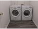 Convenient laundry room features new washer and dryer at 706 Hillmont Dr, Loganville, GA 30052