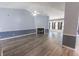 Bright living room featuring a vaulted ceiling, fan and gas fireplace at 706 Hillmont Dr, Loganville, GA 30052