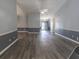 Expansive living room features hardwood floors, gray walls, and custom moulding at 706 Hillmont Dr, Loganville, GA 30052