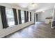 Open-concept living space featuring modern flooring and ample natural light at 706 Hillmont Dr, Loganville, GA 30052