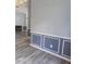 Inviting living room showcasing wood-look floors, gray walls with molding, and a view of the fireplace at 706 Hillmont Dr, Loganville, GA 30052