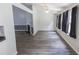Bright living room features hardwood floors, large windows, and a fireplace at 706 Hillmont Dr, Loganville, GA 30052