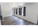 Spacious living room with abundant natural light and modern gray floors at 706 Hillmont Dr, Loganville, GA 30052