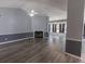 Bright living room featuring a vaulted ceiling, fan and gas fireplace at 706 Hillmont Dr, Loganville, GA 30052