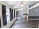 Bright living room with many windows and hardwood floors at 706 Hillmont Dr, Loganville, GA 30052