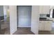 Kitchen pantry with wire shelving, next to white cabinets and dark countertops at 706 Hillmont Dr, Loganville, GA 30052
