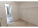 Walk-in closet with carpeted flooring and wire shelving units for optimal storage at 706 Hillmont Dr, Loganville, GA 30052