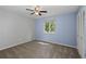 Bedroom features neutral carpet, a ceiling fan, natural light from window and closet at 880 Winfield Sw Ct, Marietta, GA 30060