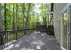 Inviting wooden deck perfect for outdoor entertaining with privacy in a wooded backyard at 880 Winfield Sw Ct, Marietta, GA 30060