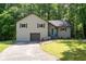 Two-story home featuring neutral siding, a front-entry garage and manicured front lawn at 880 Winfield Sw Ct, Marietta, GA 30060