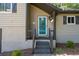 View of the house entrance, with stairs leading up to a front door with decorative glass at 880 Winfield Sw Ct, Marietta, GA 30060
