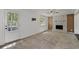 Living room featuring stone fireplace, ceiling fan, and natural light at 880 Winfield Sw Ct, Marietta, GA 30060