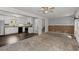 Open-concept view to the kitchen, staircase and fireplace at 880 Winfield Sw Ct, Marietta, GA 30060