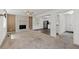 Spacious living room with white stone fireplace and open view to the modern kitchen at 880 Winfield Sw Ct, Marietta, GA 30060