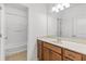 Bathroom with a single vanity with a white countertop and a shower-tub combination at 1536 Baxley Pine Trce, Suwanee, GA 30024