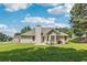 Expansive backyard featuring a well-maintained lawn and mature trees, offering a serene outdoor space at 2410 Napa Valley Dr, Villa Rica, GA 30180