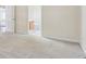 Spacious bedroom featuring neutral walls, carpet flooring and open door to the bathroom at 2410 Napa Valley Dr, Villa Rica, GA 30180