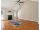 Open living room with hardwood floors, fireplace, and a door leading to the backyard at 2410 Napa Valley Dr, Villa Rica, GA 30180